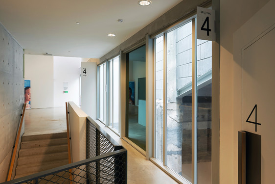 The glass tower manage vertical traffic and access to the screens